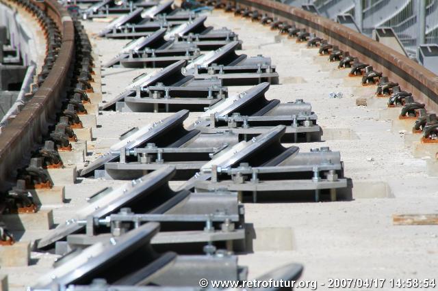 The cable stay bridge over the river Inn : ...which requires a number of pulleys to divert the traction cables...