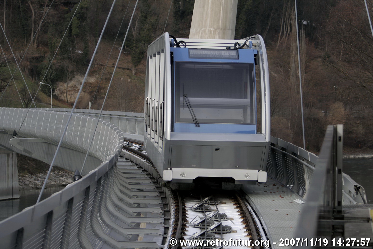 The cable stay bridge over the river Inn : Vehicle on a test run on the bridge.