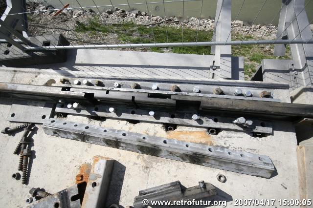 The cable stay bridge over the river Inn : Extensible rail interface between fixed land base and floating bridge table.