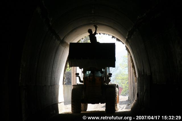 Steep tunnel : A worker involved in finishing the tunnel shell