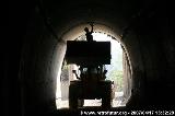 Steep tunnel : A worker involved in finishing the tunnel shell